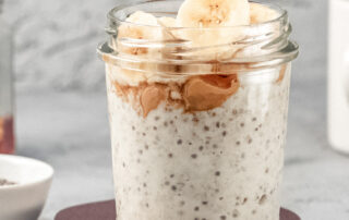 Overnight oats in a glass jar topped with banana slices