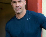 Portrait of San Diego personal trainer Chris Keith in a navy t-shirt