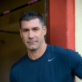 Portrait of San Diego personal trainer Chris Keith in a navy t-shirt