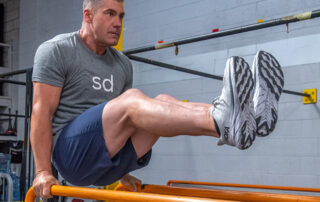 Chris Keith Personal Trainer on the parallel bars